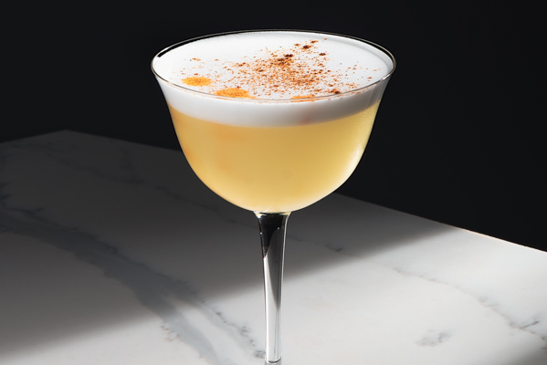 2 ounces of Pisco for a vintage cocktail in a chilled glass by ferals Studio via unsplash