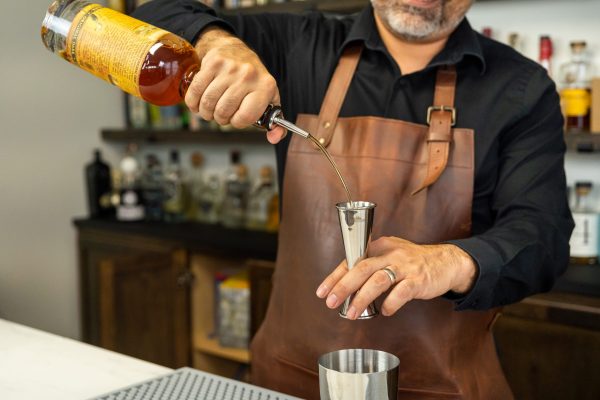 An alcohol pour spout as a bar pest control product for vinegar flies