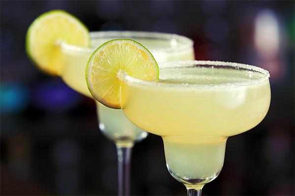 margarita with margarita mix and 2 ounces tequila and triple sec with fresh-squeezed lime juice and a slice of lime.jpg