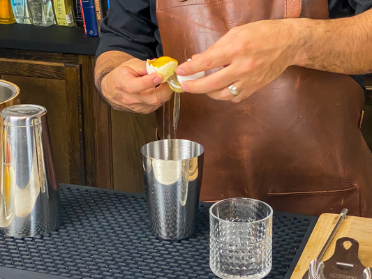 2. breaking an egg into a cocktail shaker