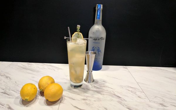 tall cocktail made of lemons and thyme