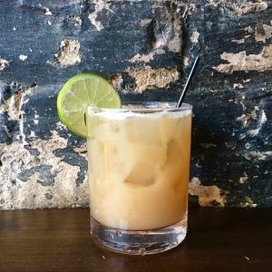 Mountain Top cocktail in a rocks glass with lime wheel garnish