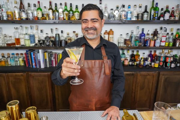 Bartender holding a Martini