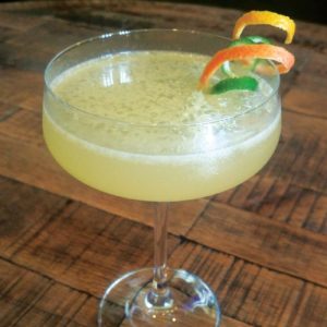 Sunny Bunch cocktail-- a yellow drink in a chilled coupe glass