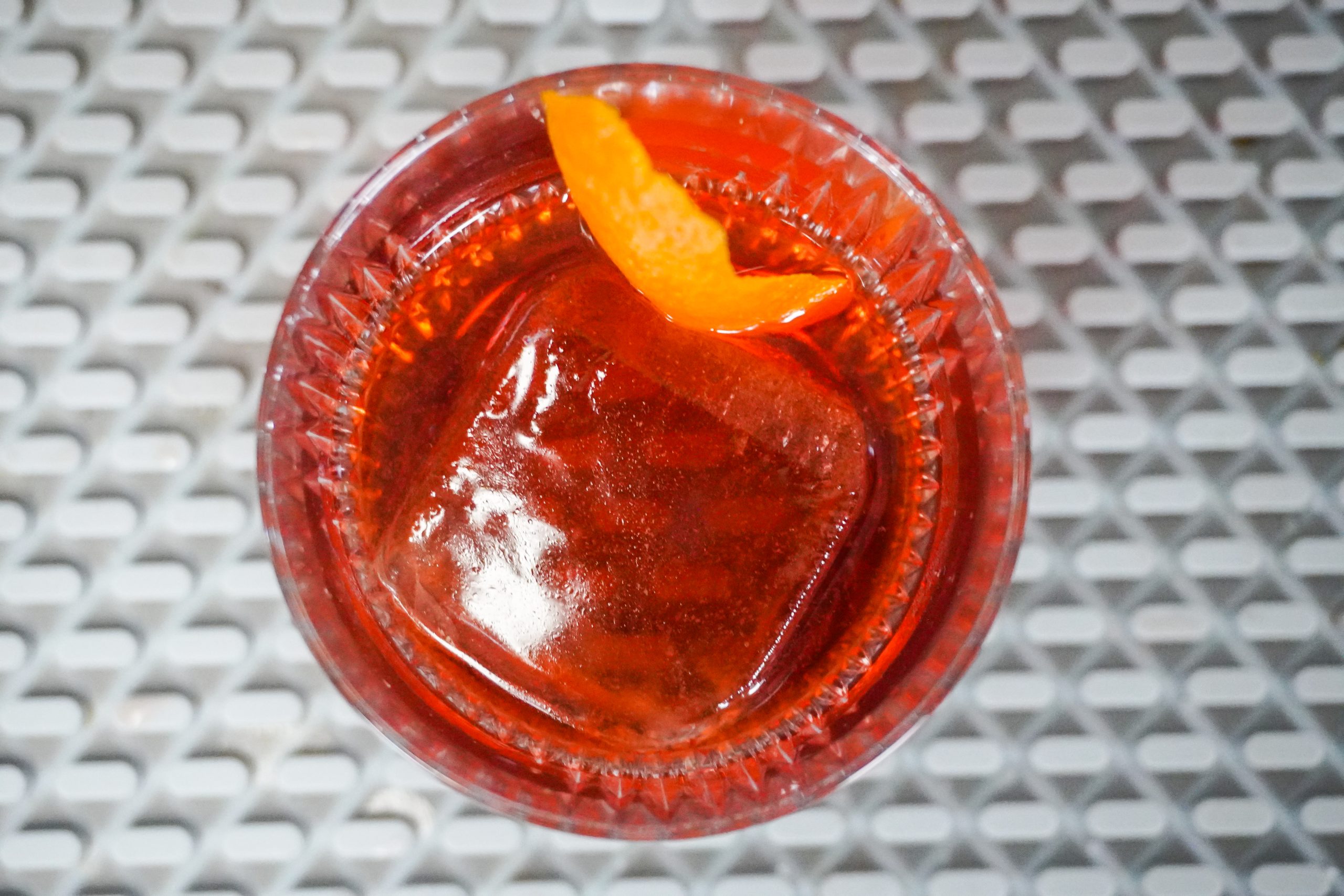 Negroni is a nice cocktail for a hot day with a large format ice cube
