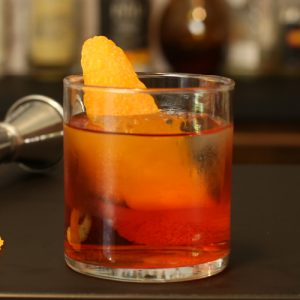Original Negroni in a cocktail glass with an orange twist