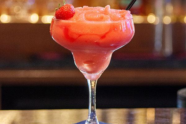 Frozen strawberry daiquiri with a fresh strawberry garnish by Maria Georgieva via Unsplash.com