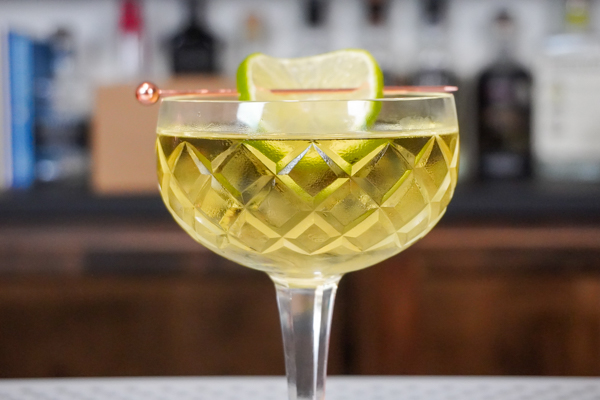 Gimlet cocktail drink with 2 ounces gin and a lime wedge