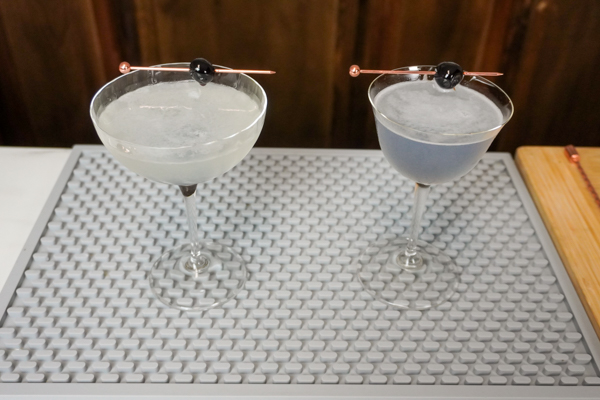 Two Aviation drinks with .5 ounce lemon juice and a cocktail maraschino cherry instead of lemon peel-2