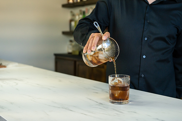 Straining from a mixing glass with julep strainer