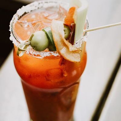 Bloody Mary cocktail with garnishes and a salt rim by Toni Osmundson via unsplash.com