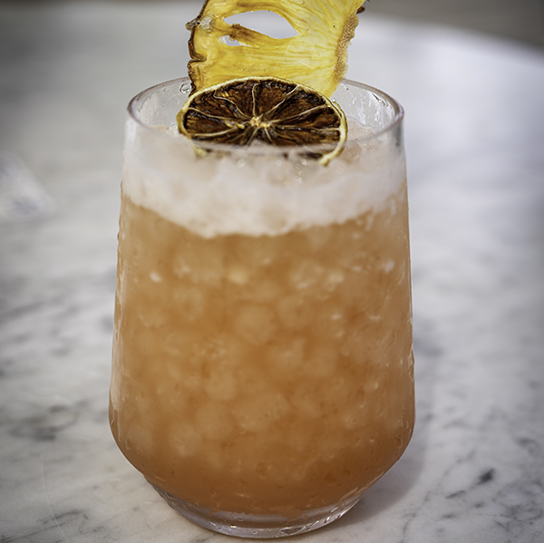 topical drink with fresh pineapple and 1 ounce white rum by alexandra tran via unsplash