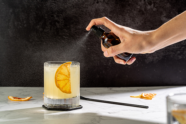 Industry standard glass olive oil bottle for spraying vermouth or oil into a cocktail, 2 oz size bottle