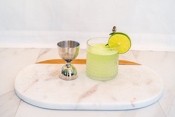 Bell jigger with cocktail