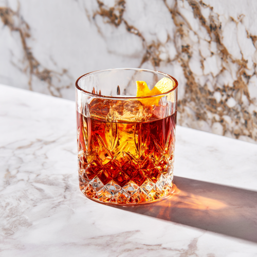 a sazerac in a glass with absinthe, an anise-flavored liqueur