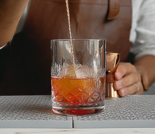 stirring 50 percent whiskey and 50 percent cognac french brandy