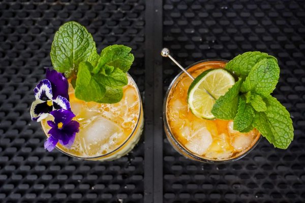 6. Mai Tai cocktails with 2-3 mint leaves each, one with 3:4 ounce orange Curaçao liqueur in an ice-filled rocks glass