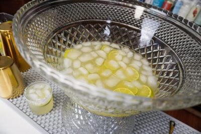 authentic margarita with 2 ounce of lime juice per drink, garnish with lime wheels in a punch bowl for larger margarita recipe