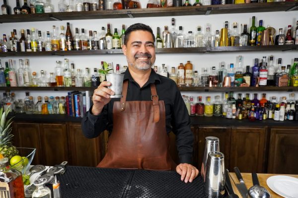 5. bartender holding a classic bourbon cocktail