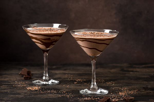 2. Godiva chocolate martini in glass with chocolate syrup for special occasionals via Adoba Stock