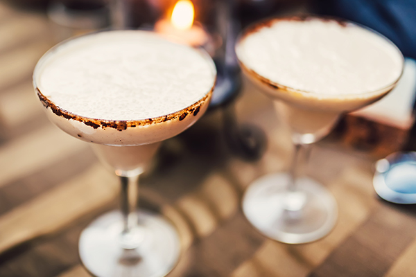 6. while chocolate martini with drizzle chocolate syrup in 2 glasses