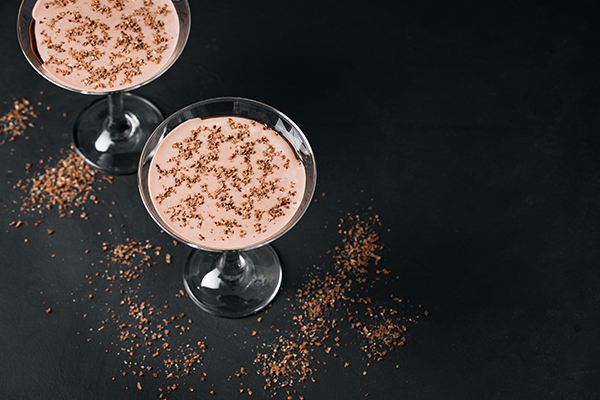 7. decadent cocktail dessert martini with milk chocolate liqueur, Irish cream, and chocolate for optional garnish in martini glasses