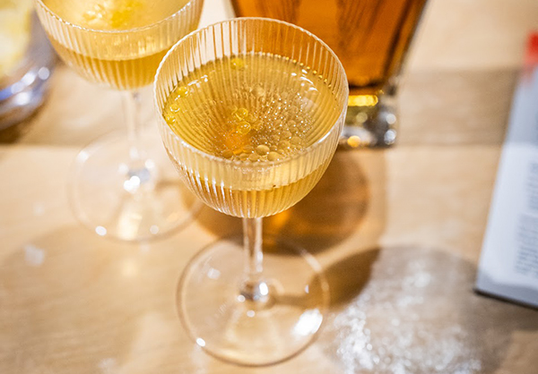 light gold colored cocktail in a Nick and Nora glass, made with straight bourbon whiskey from Angel's Envy bourbon distillery