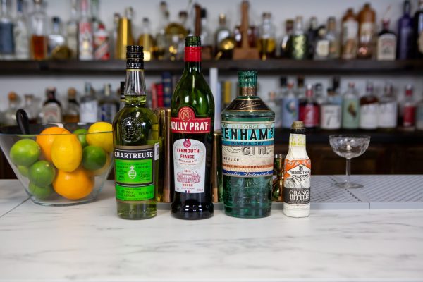 bottles of alcohol, the ingredients for a Bijou drink