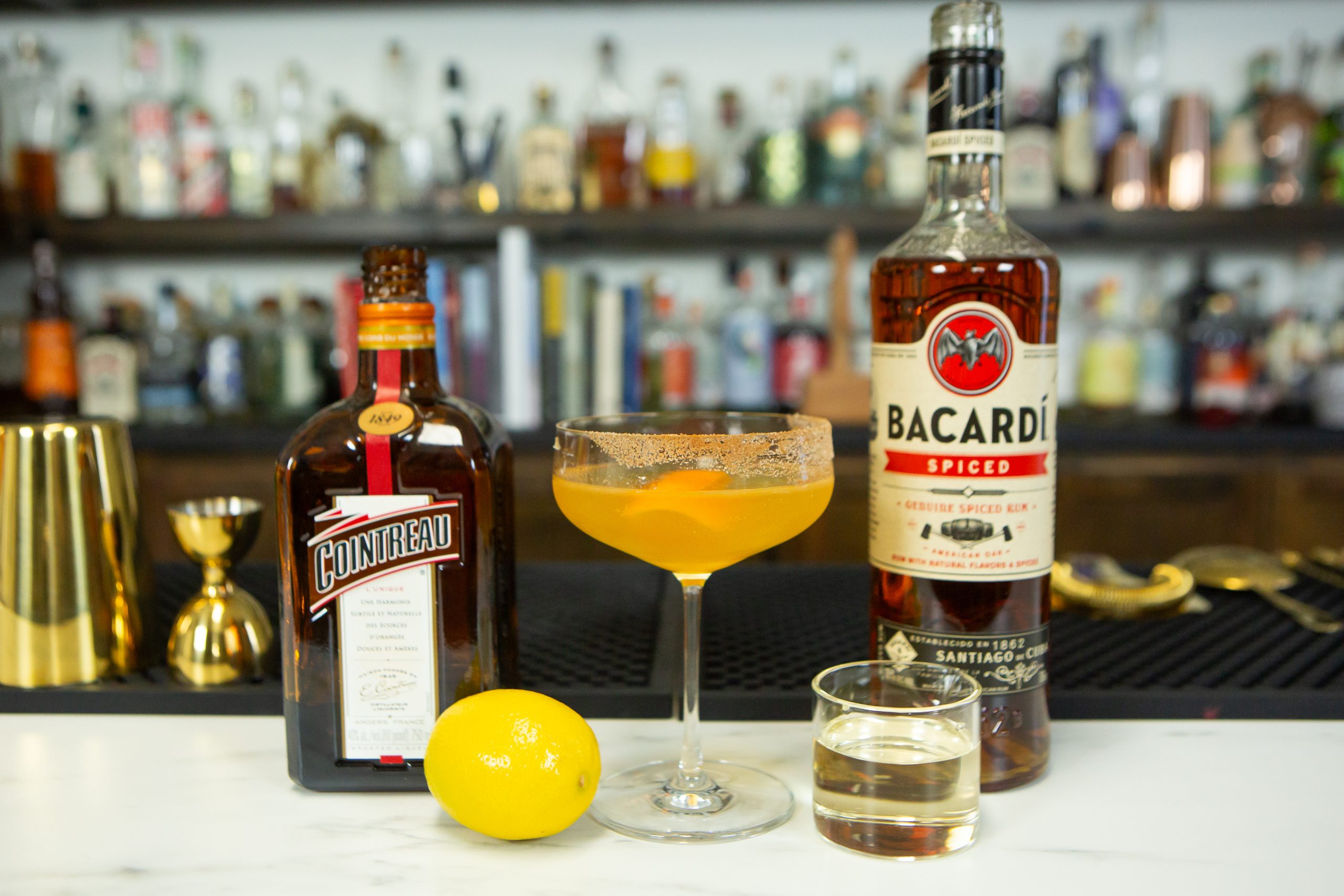 Cable Car: A riff on the classic drink recipe, Sidecar, next to its liquid ingredients