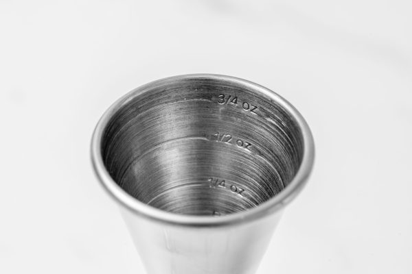 a close-up of a jigger's internal measurement markings