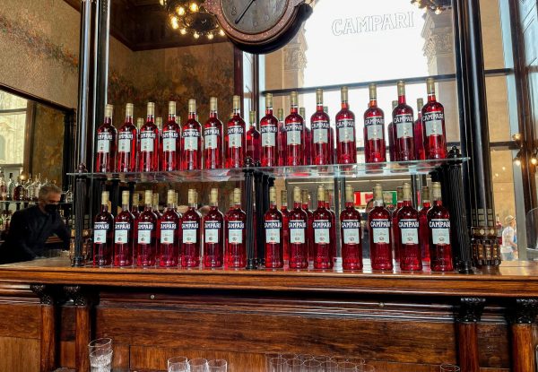 a back bar full of bottles of Campari