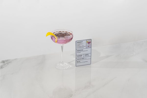Aviation cocktail in a chilled coupe glass next to its recipe